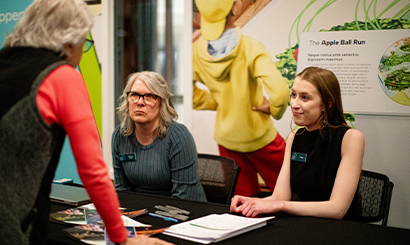 Work with Us Staff at Table